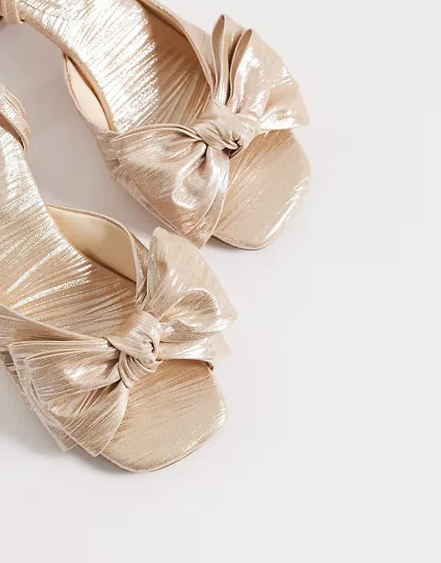Happiness bow detail block heeled sandals in pale gold plisse