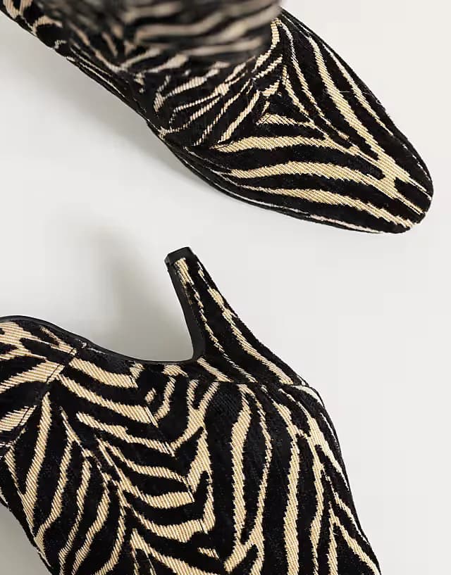 Contessa cone heel slouchy knee boots in zebra print