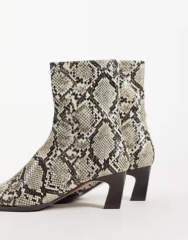 Rudy chisel toe heeled sock boots in snake print