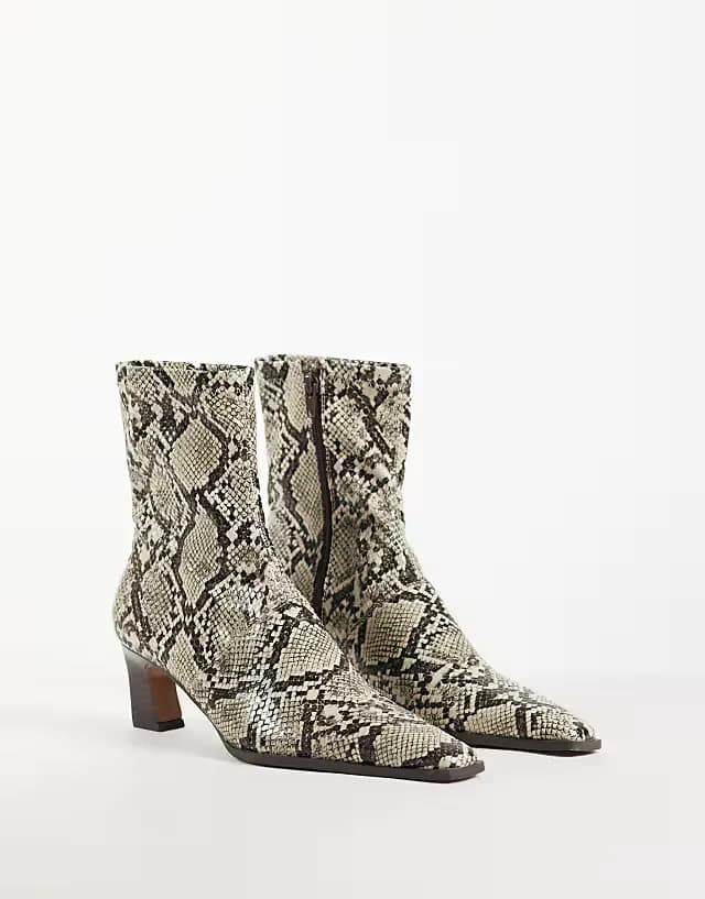 Rudy chisel toe heeled sock boots in snake print