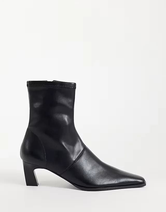 Rudy chisel toe heeled sock boots in black